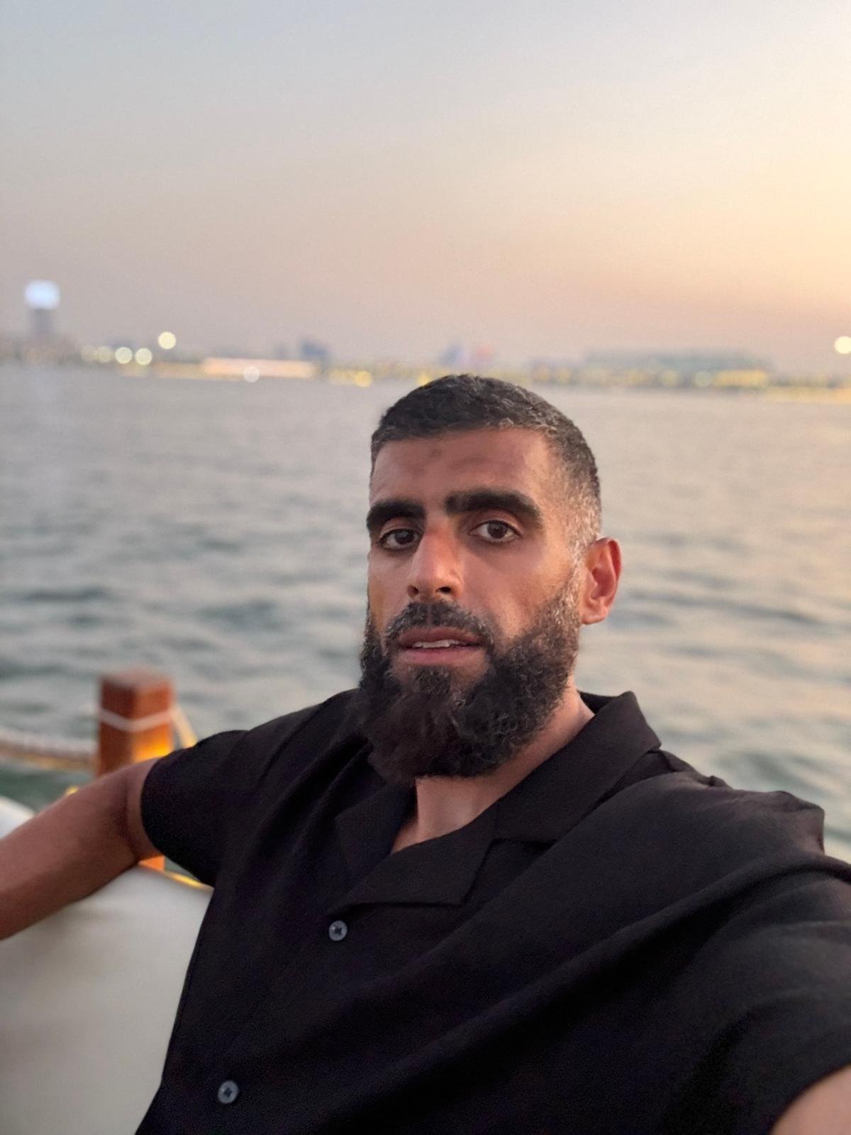 Mohammed, founder of Muslim Body Coach, by the water at sunset